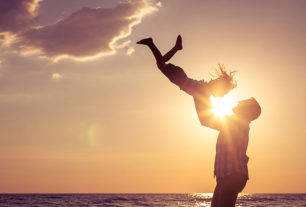 Dad lifting son in the air