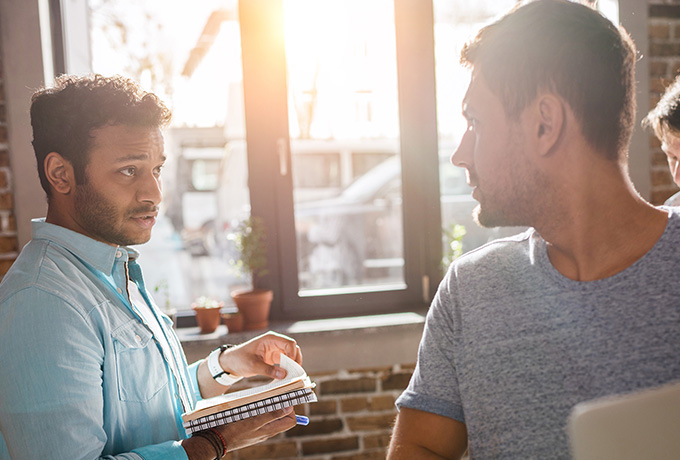 Man being confronted, and referring to his anger management toolkit