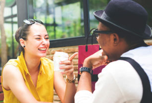 Couple sitting laughing - great communication skills