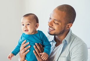 First time dad holding a newborn baby