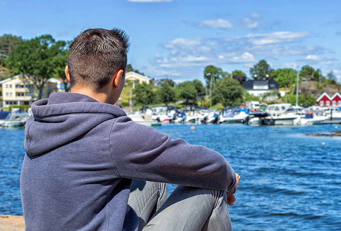 Man sat looking out to sea after a relationship separation
