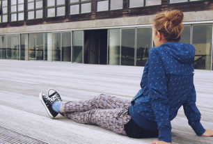 Talking to your teenagers: Teenager sitting with her back to us looking moody