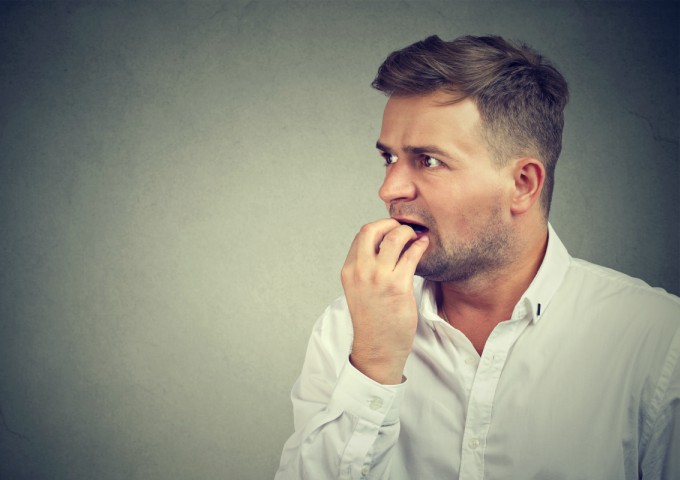 Man experiencing the symptoms of a panic attack