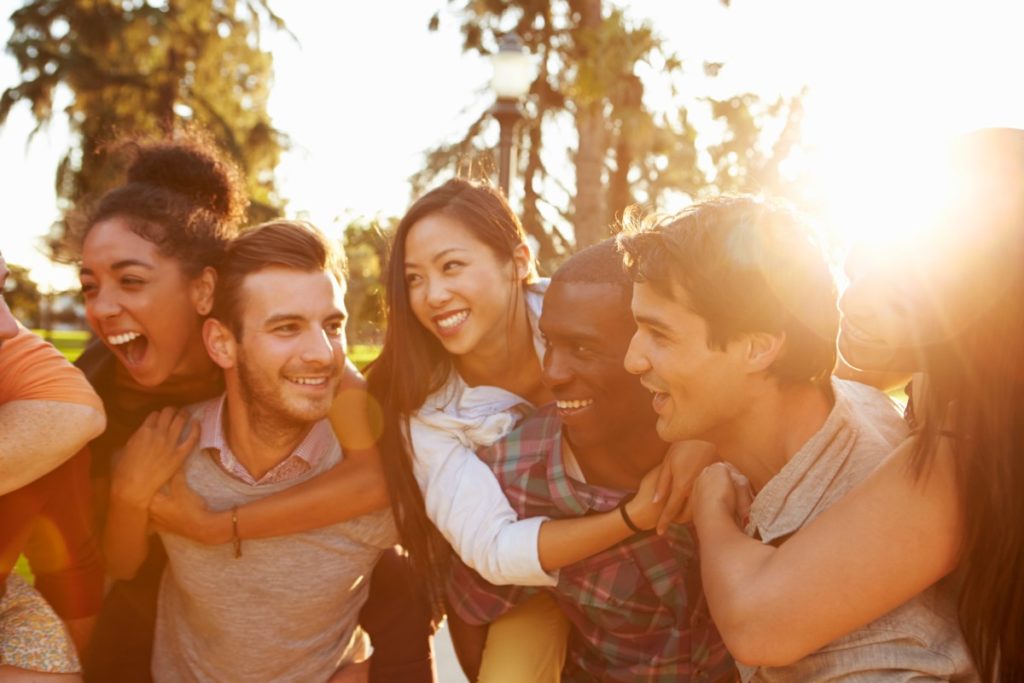 Group of friends in sunshine - social connections are key to good mental health