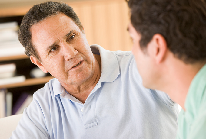 Father and son sat talking