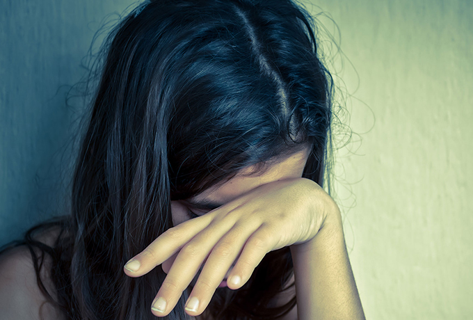a women sat crying