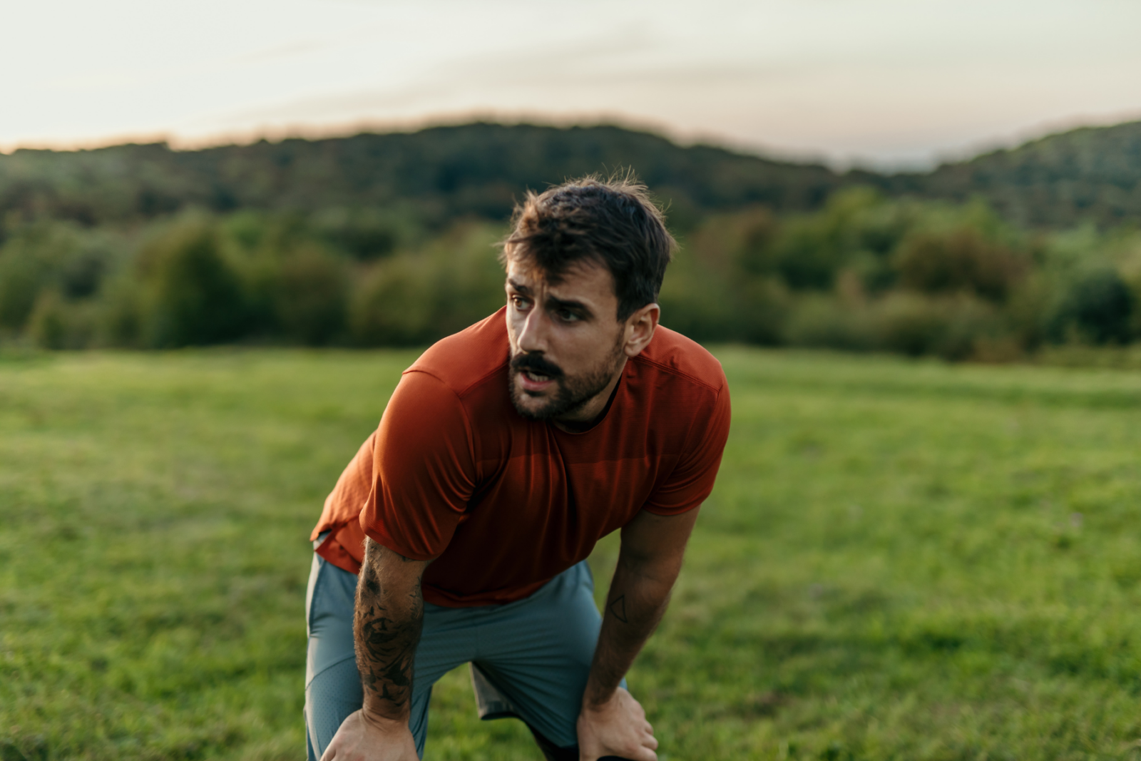 Man taking a rest whilst exercising outdoors