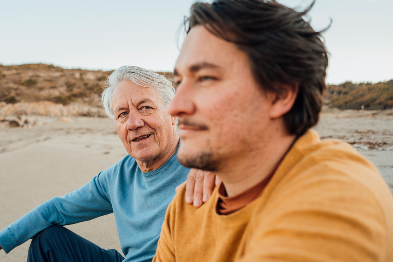 two men - hand on shoulder